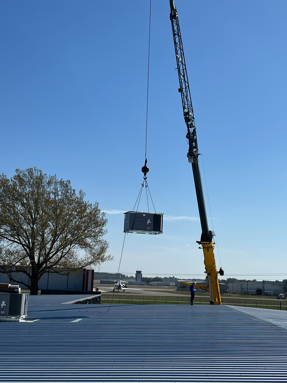 HVAC equipment being positioned for an air conditioning installation in Longview, Texas